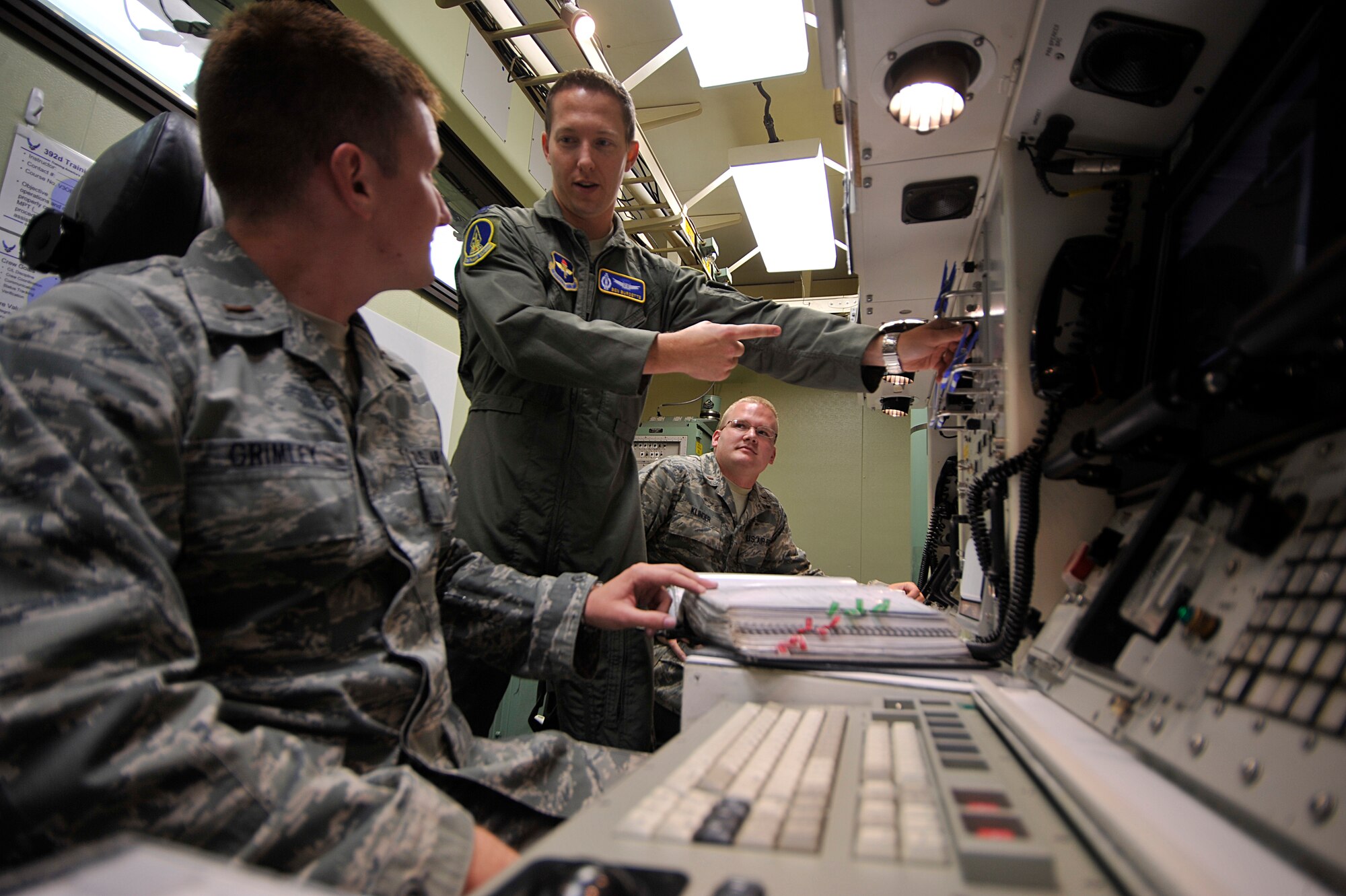 VANDENBERG AIR FORCE BASE, Calif. -- Capt. Benjamin Burdette, 392nd Training Squadron assistant flight commander, demonstrates operating procedures for his students here Friday, Aug. 26, 2011.  Captain Burdette was selected as the Company Grade Officer, Space and Missile Systems Operator of the Year Award for 2010.  (U.S. Air Force photo/Staff Sgt. Andrew Satran) 