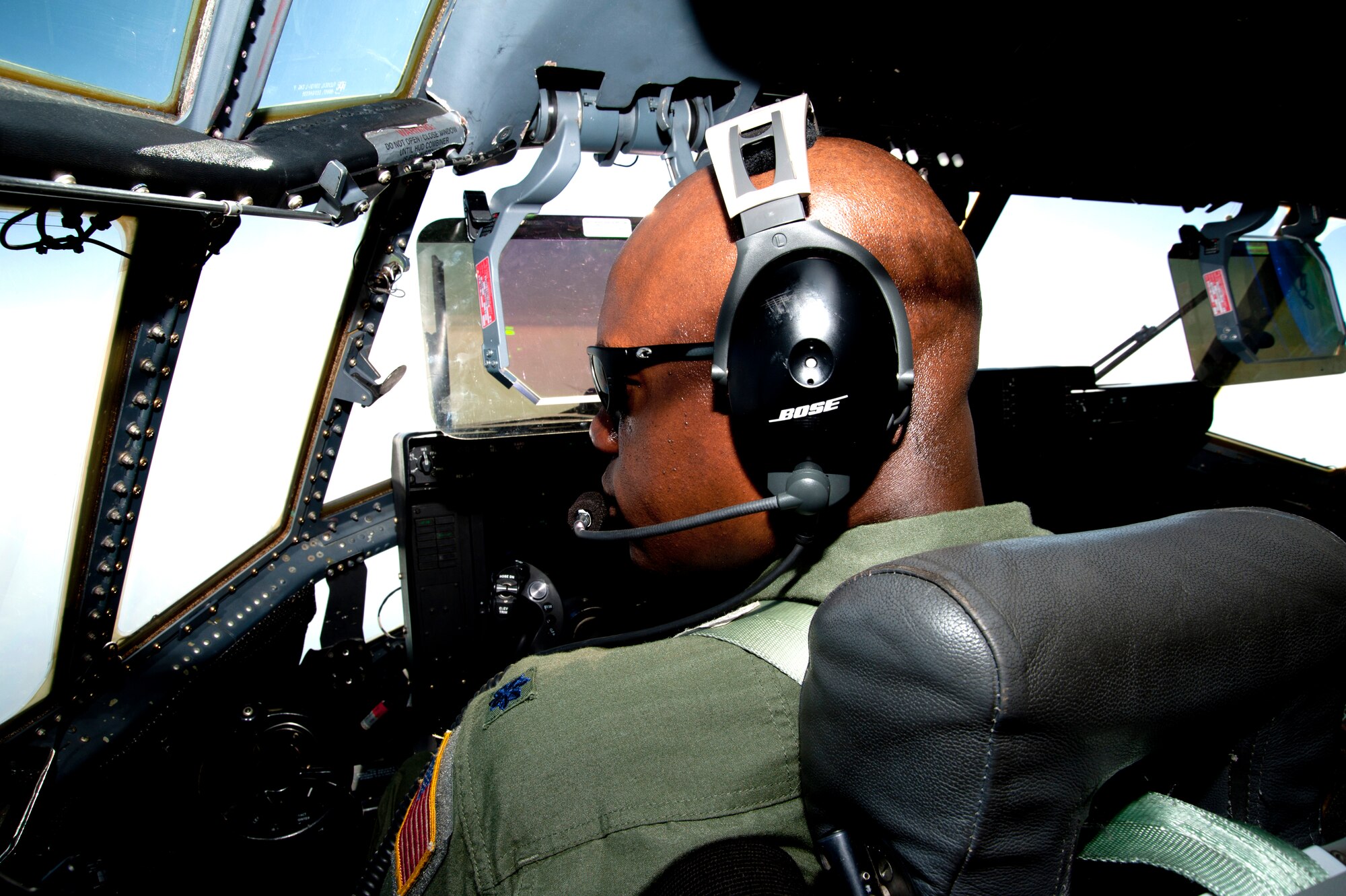 Lt. Col. Darryl Woods, 53rd Weather Reconnaissance Squadron pilot and aircraft commander, glances outside the cockpit as he flies toward Hurricane Irene August 27. Before the WC-130J aircraft arrived at Irene, the storm had already made landfall over the North Carolina coast. This was the Hurricane Hunters’ second-to-last flight into the storm before it pushed further north. (U.S. Air Force photo/Tech. Sgt. Ryan Labadens)