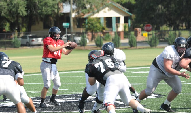 The Valdosta State University football team runs a play during a scrimmage held in appreciation for active duty, civilians and family members of the moody community Aug. 26, 2011. VSU’s first game is scheduled for Sept. 3 at Wingate University, N.C., against the Bulldogs (U.S. Air Force photo by Airman 1st Class Paul Francis/Released)