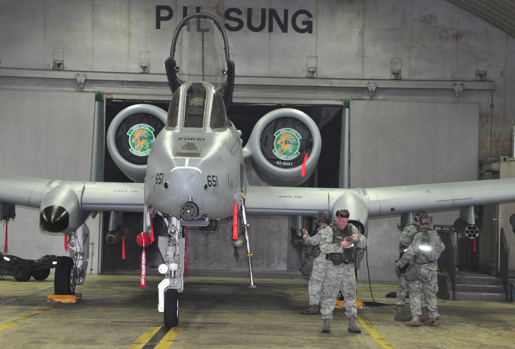 Airmen with the 51st Maintenance Group load munitions onto an A-10 Thunderbolt II assigned to the 25th Fighter Squadron August 29, 2011, during an Operation Readiness Exercise. Exercises such as this test Osan's ability to survive and operate during a war-time constraint. (U.S. Air Force photo/Tech. Sgt. Chad Thompson)