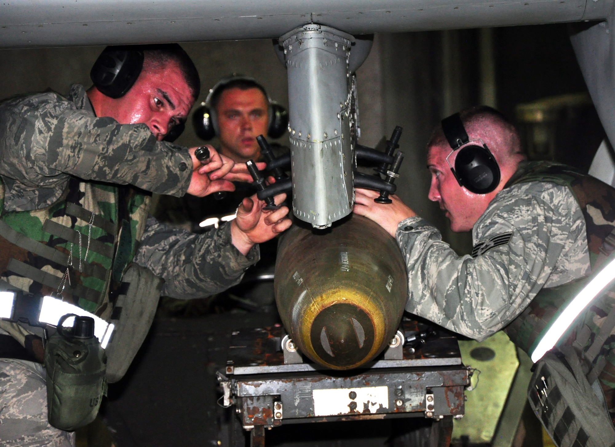 Airmen with the 51st Maintenance Group load munitions onto an A-10 Thunderbolt II assigned to the 25th Fighter Squadron August 29, 2011, during an Operation Readiness Exercise. Exercises such as this test Osan's ability to survive and operate during a war-time constraint. (U.S. Air Force photo/Tech. Sgt. Chad Thompson)
