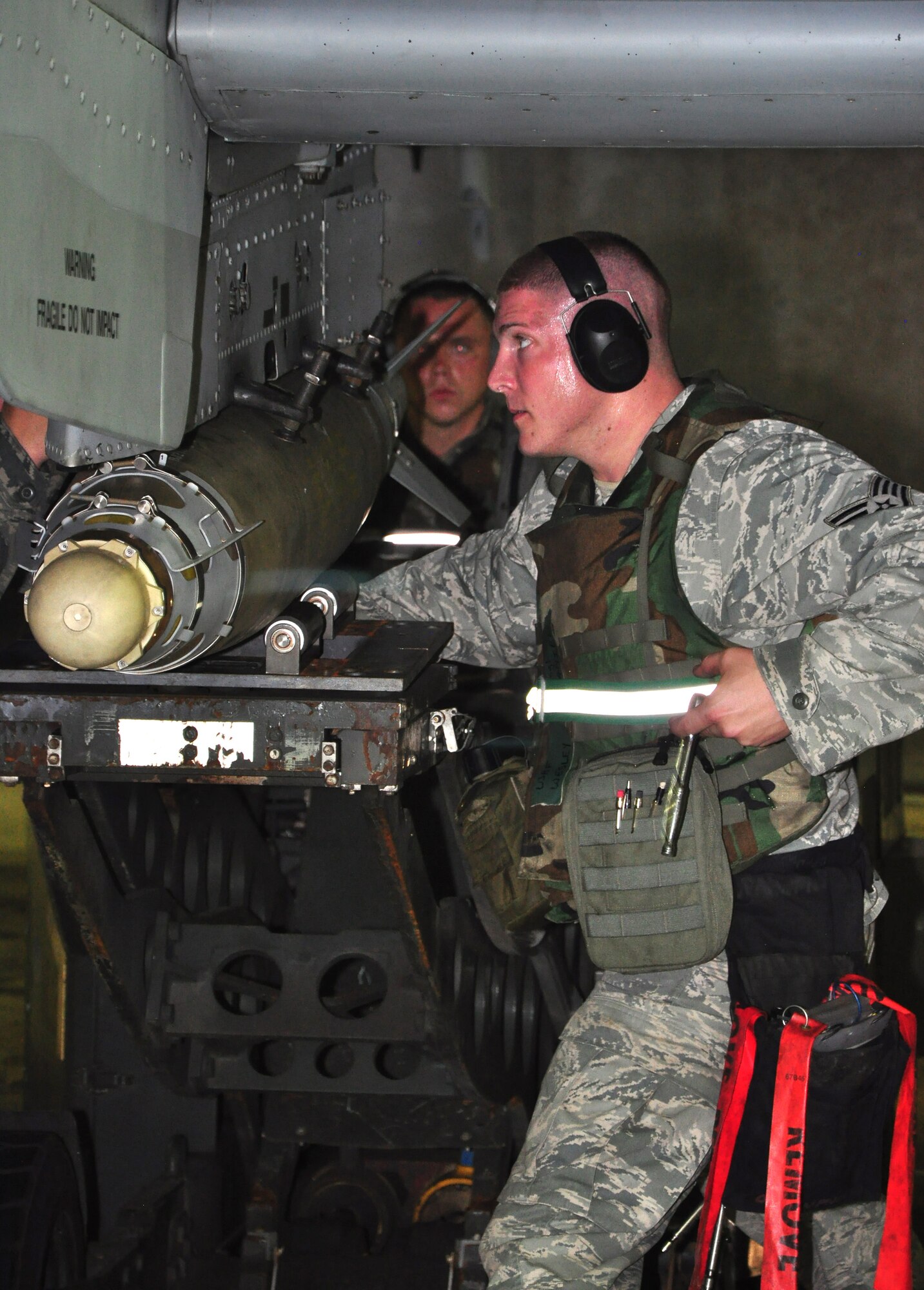 Airmen with the 51st Maintenance Group load munitions onto an A-10 Thunderbolt II assigned to the 25th Fighter Squadron August 29, 2011, during an Operation Readiness Exercise. Exercises such as this test Osan's ability to survive and operate during a war-time constraint. (U.S. Air Force photo/Tech. Sgt. Chad Thompson)