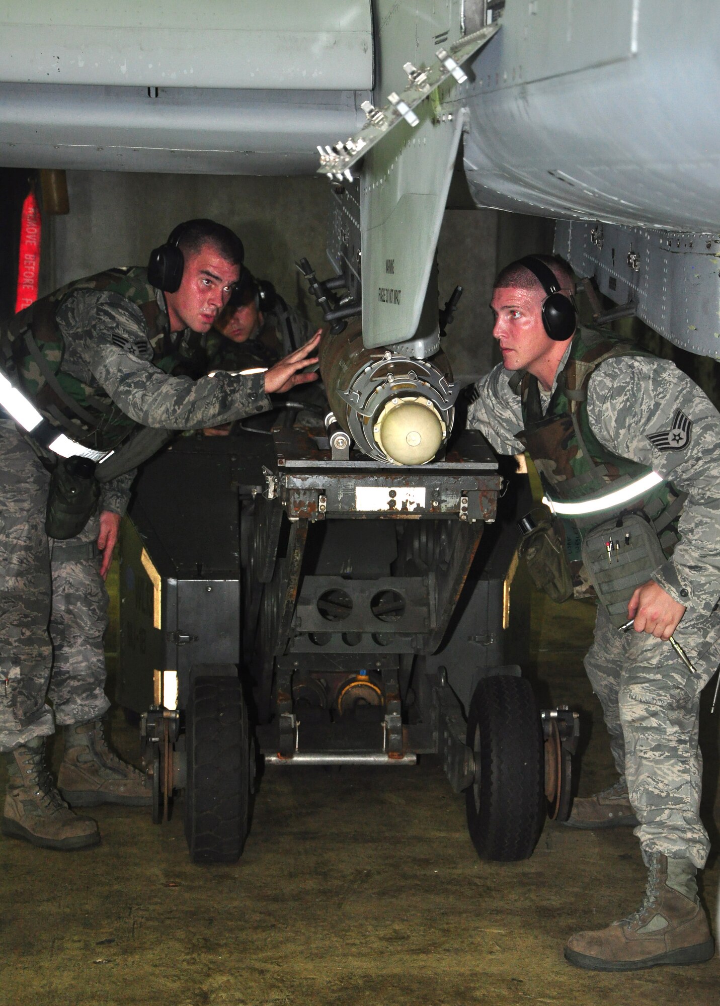 Airmen with the 51st Maintenance Group load munitions onto an A-10 Thunderbolt II assigned to the 25th Fighter Squadron August 29, 2011, during an Operation Readiness Exercise. Exercises such as this test Osan's ability to survive and operate during a war-time constraint. (U.S. Air Force photo/Tech. Sgt. Chad Thompson)
