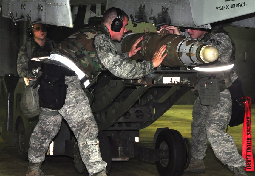 Airmen with the 51st Maintenance Group load munitions onto an A-10 Thunderbolt II assigned to the 25th Fighter Squadron August 29, 2011, during an Operation Readiness Exercise. Exercises such as this test Osan's ability to survive and operate during a war-time constraint. (U.S. Air Force photo/Tech. Sgt. Chad Thompson)