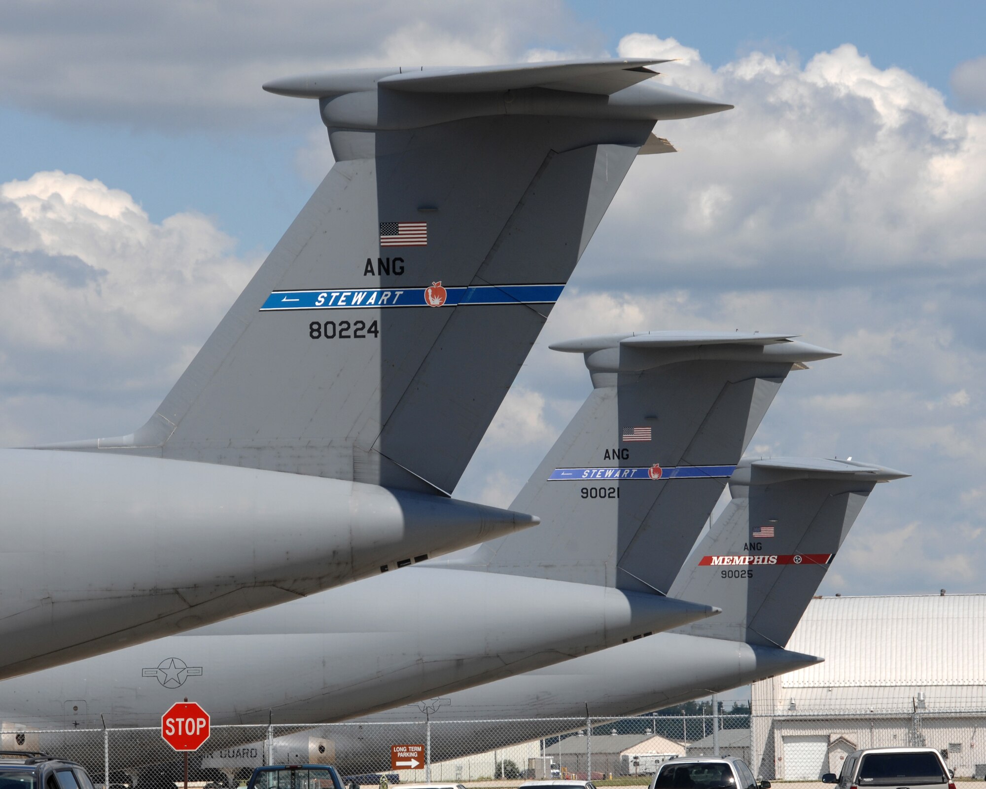 Tail markings identify home stations for these aircraft seeking shelter at Wright-Patterson from Hurricane Irene.  (US Air Force photo by Ben Strasser)     