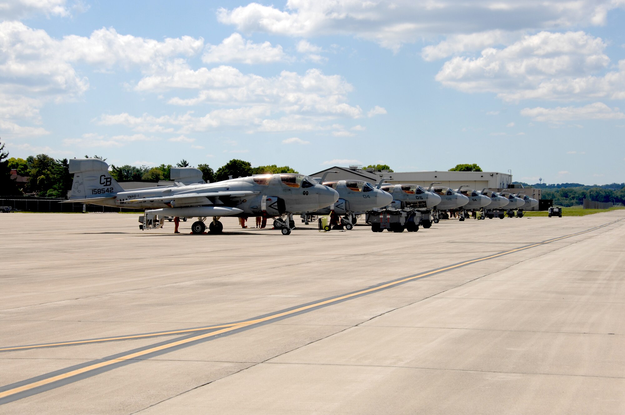 Eight Marine EA-6B Prowlers sit parked in a row at Wright-Patterson.  Members from the 88th Air Base Wing prepare and train every hurricane season to support a wide variety of aircraft and their crews.  (US Air Force photo by Ben Strasser)     