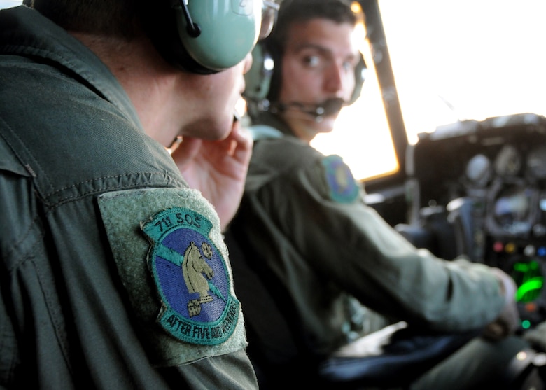 Master Sgt. Mike Vasquez, a flight engineer for 711th Special Operations Squadron, advises pilot, Capt John Karlesky, on the MC-130E Combat Talon I aircraft’s flight system status during a training flight out of Duke Field, Fla, Aug. 2011. The flight engineer monitors the aircraft systems and calculates performance capabilities of the aircraft. The 711th SOS, part of the 919th Special Operations Wing, conducts flight training missions five days a week to maintain currency on all of their readiness requirements. (U.S. Air Force photo/Tech. Sgt. Cheryl Foster)