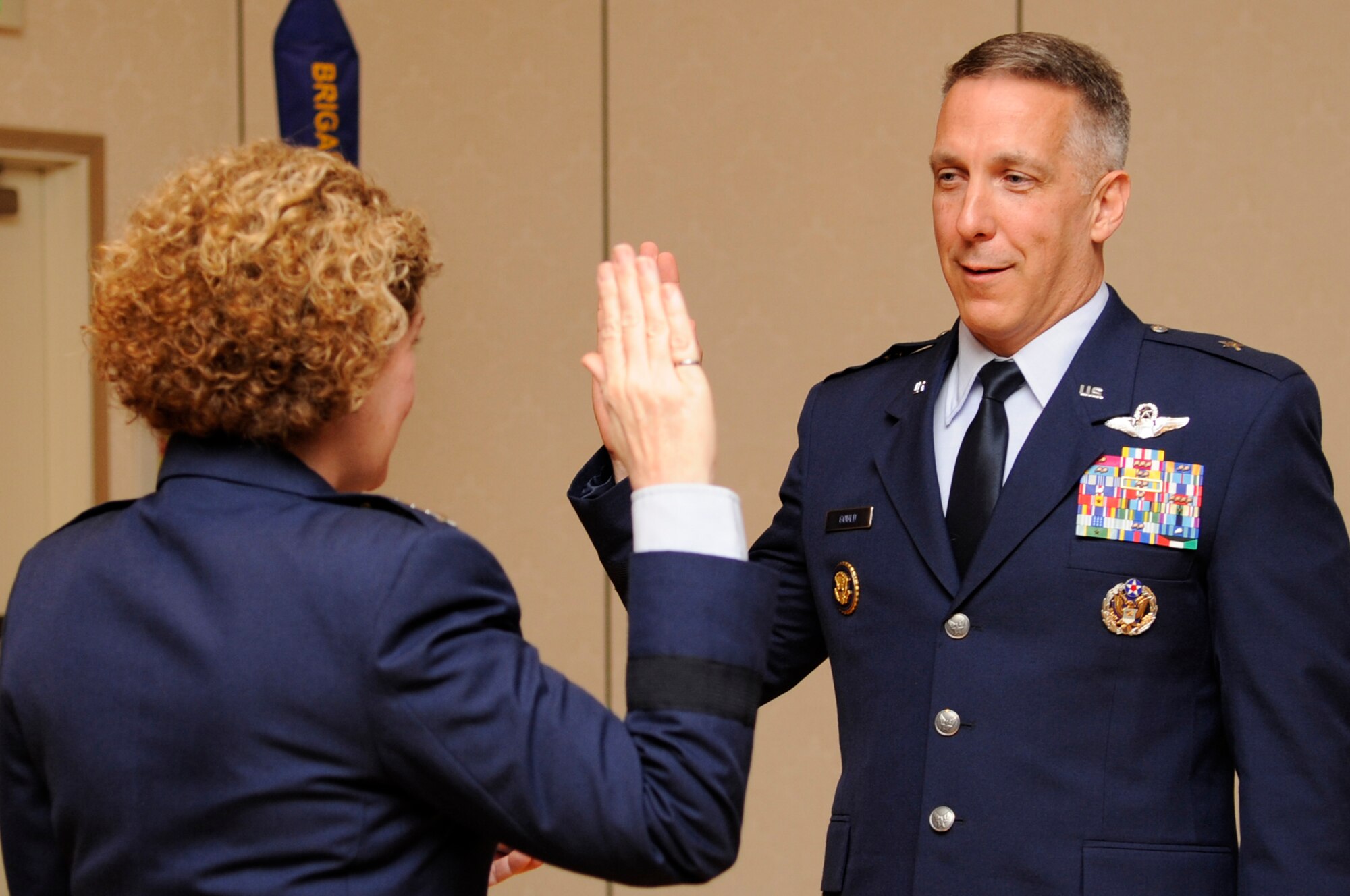 VANDENBERG AIR FORCE BASE, Calif. – Lt. Gen. Susan J. Helms, the 14th Air Force and Joint Functional Component Command for Space commander, leads Brig. Gen. Thomas F. Gould, the 14th AF vice commander, in the oath of office during his promotion ceremony at the Pacific Coast Club here Friday, Aug. 26, 2011. (U.S. Air Force photo/Senior Airman Lael Huss)