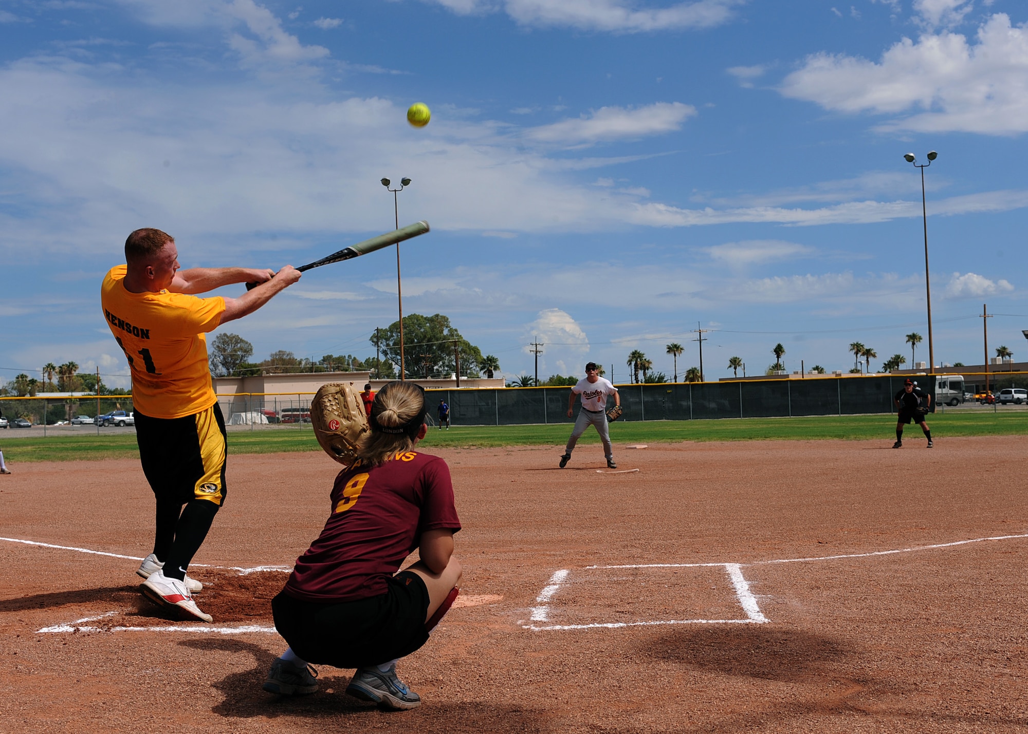 DAVIS-MONTHAN AIR FORCE BASE, Ariz. – Kristopher Henson, second baseman for the Desert Lightning 1st Six Council softball team, swings his bat at a pitch during the Company Grade Officer Council and 1st Six softball game here Aug. 25. The CGOC defeated the 1st Six, 18-16. (U.S. Air Force photo/ Airman 1st Class Christine Halan) 