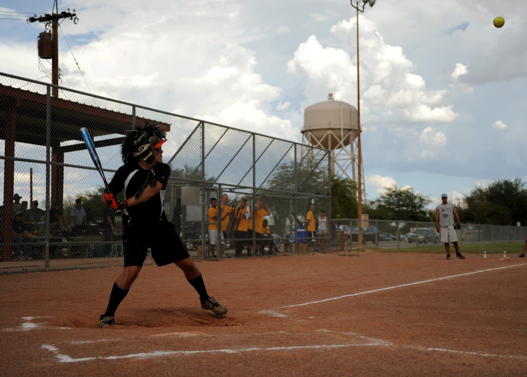DAVIS-MONTHAN AIR FORCE BASE, Ariz. –Matt Griffie, coach and second baseman for the Company Grade Officer Council softball team, swings his bat at a pitch during the CGOC and the Desert Lightning 1st Six softball game here Aug. 25. The CGOC defeated the 1st Six, 18-16. (U.S. Air Force photo/ Airman 1st Class Christine Halan) 