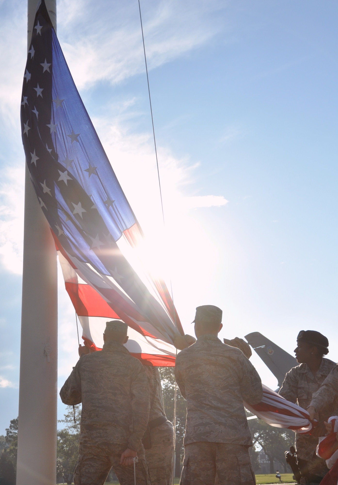Airmen from the 633rd Security Forces Squadron and 633rd Civil Engineer Squadron prepare to raise the installation colors at Langley Air Force Base, Va., following Hurricane Irene Aug. 28, 2011. Officials said the storm knocked out power to more than 4 million people and was responsible for at least 20 deaths along the East Coast. (U.S. Air Force photo by Senior Airman Jason Joel Brown/RELEASED)