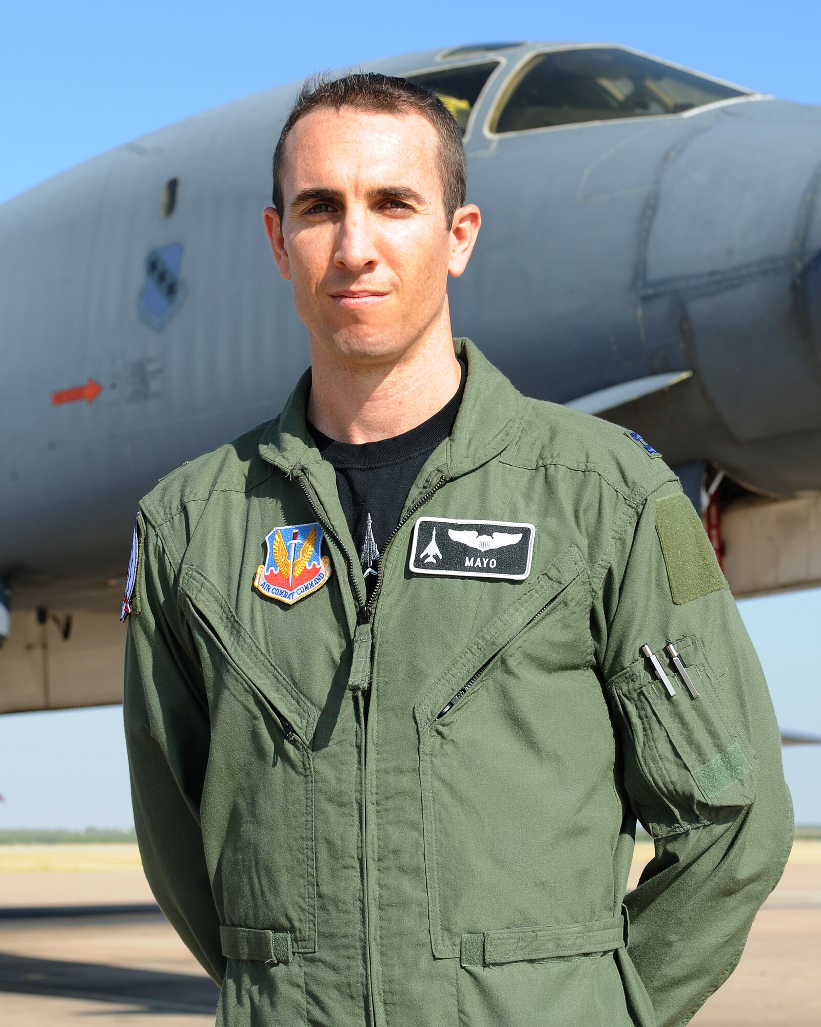 Capt. Mike 'Mayo Taylor, 77th Weapons Squadron student poses in front of a B-1 Bomber July 22, 2011 on the flight line at Dyess AFB, Texas. Recently, Mayo along with the rest of class 11B completed the Defensive Tactics phase of the course. (U.S. Air Force photo by Tech. Sgt. Darcie Ibidapo/ Released)
