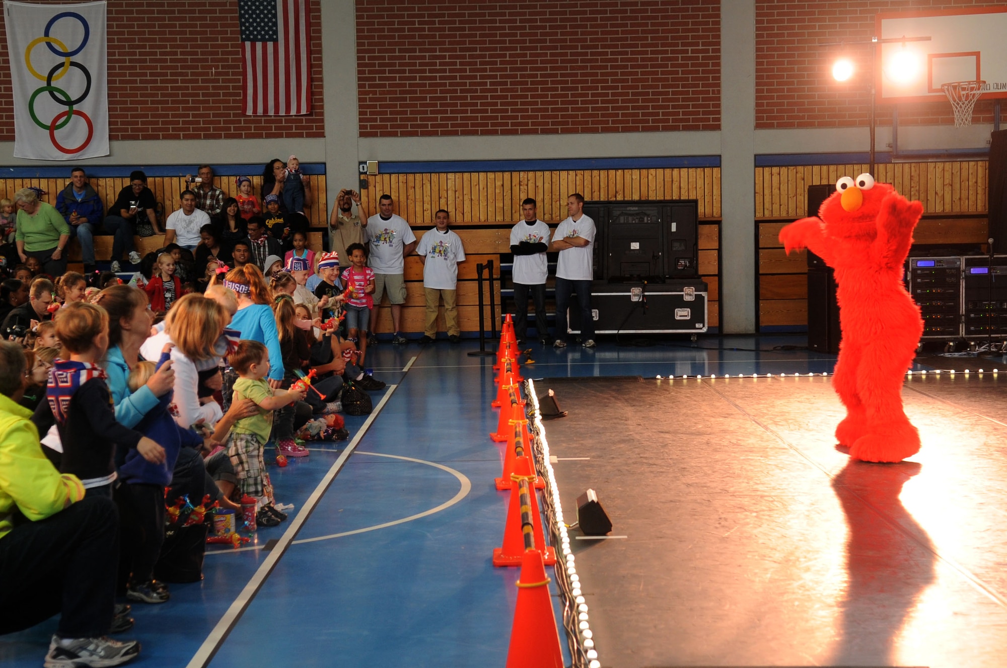 Families throughout the Kaiserslautern Military Community are entertained during the Sesame Street/USO Experience for Military Families Tour, Ramstein Air Base, Germany, Aug. 27, 2011. The 25-minute high-energy show follows a new character, Katie, as she opens up about her fears and excitement of moving to a new base. With the help of Elmo and other Sesame pals, Katie finds ways to deal with change and gets ideas on how to make new friends while keeping in touch with her old ones. (U.S. Air Force photo by Senior Airman Brittany Perry)