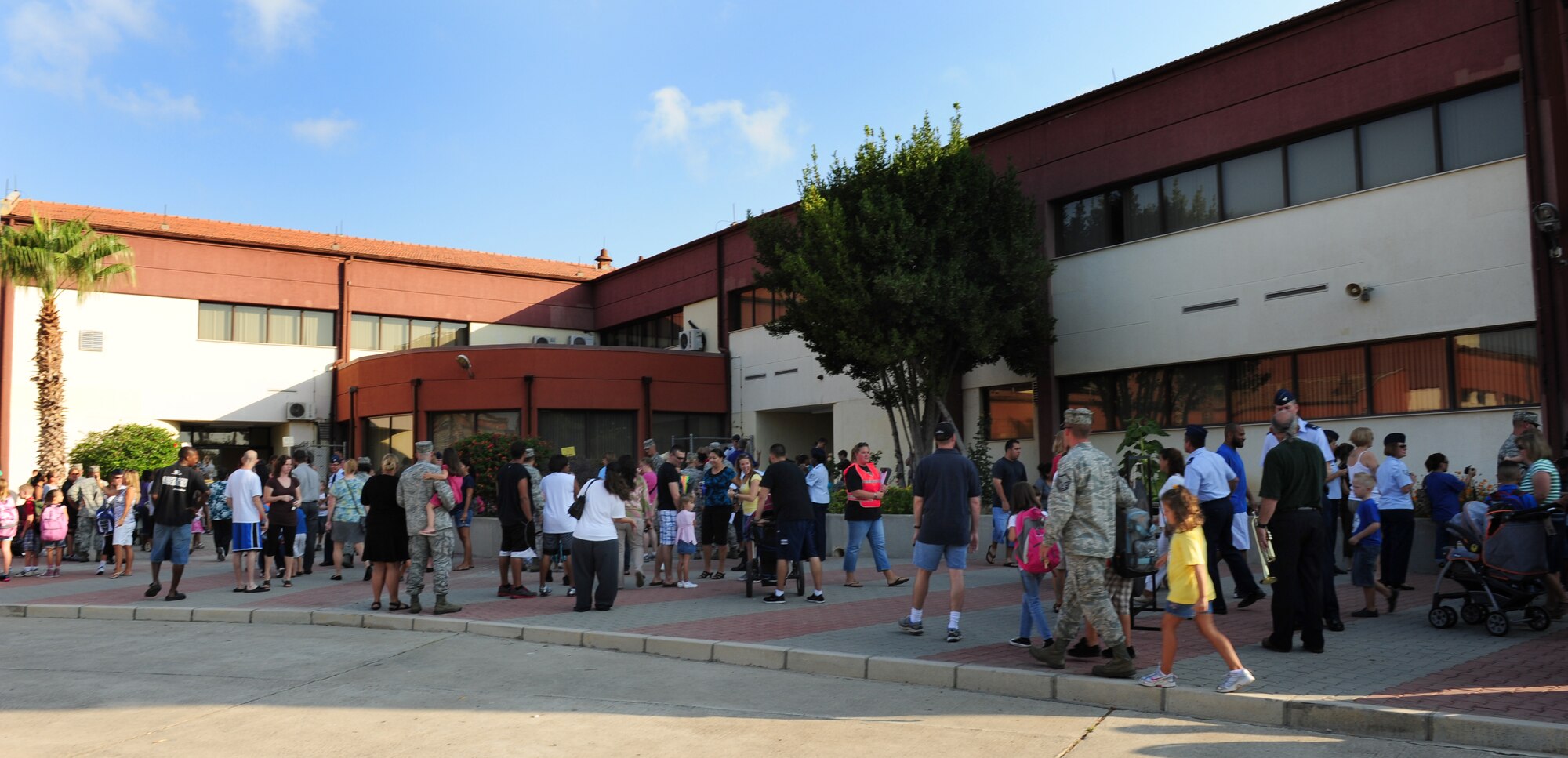 Airmen and their children gather as the first school day of the year begins Aug. 29, 2011, at Incirlik Air Base, Turkey. All grades began school today except kindergarten, which will begin the day after Labor Day. Airmen were encouraged to walk their children to their first day of school. (U.S. Air Force photo by Senior Airman Anthony Sanchelli/Released)

