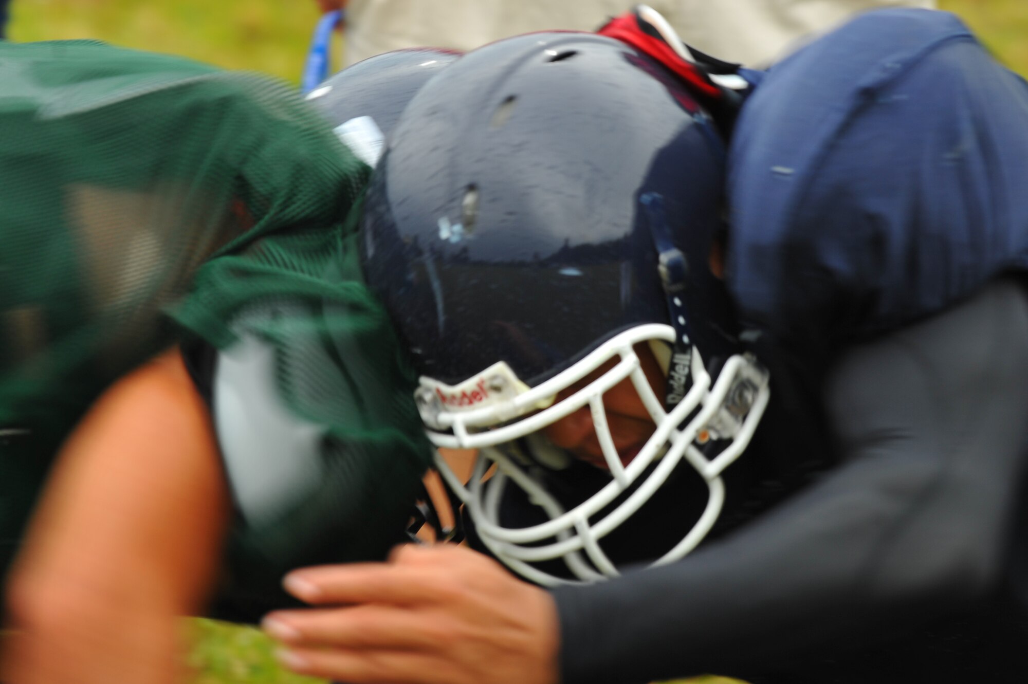 BITBURG ANNEX, Germany – Bitburg High School football players run offensive and defensive blocking drills during football practice here Aug. 24. The football team practices five days each week. Practices normally consist of a warm-up, cardio, strengthening exercises, hitting drills, blocking drills and running drills. The season tentatively kicks off with an away game against Heidleberg on Sept. 3. (U.S Air Force photo/Airman 1st Class Dillon Davis)