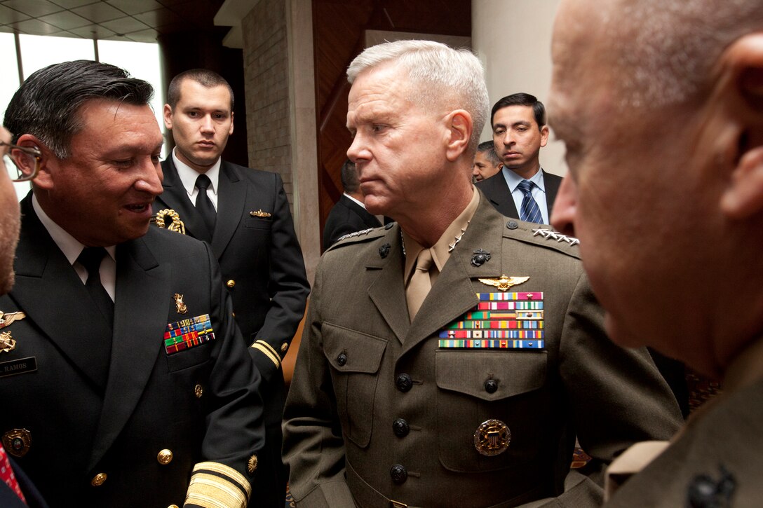 LIMA, Peru (Aug. 30, 2011) - Gen. James F. Amos, 35th commandant of the U.S. Marine Corps and Peruvian Rear Adm. Luis Vargas, commandant of the Peruvian Marine Corps speak to one another in between events during the Marine Leaders of Americas Conference (MLAC) 2011. MLAC is an international conference designed to increase engagement among partner nation's Marine Corps' and Naval Infantries across North, Central and South America. ::r::::n::::r::::n::