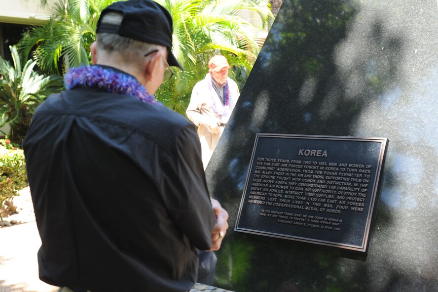 JOINT BASE PEARL HARBOR-HICKAM, Hawaii -A World War II veteran stops to read a plaque about Korea during a tour of the Courtyard of Heros here, Aug. 30, 2011.. The tour was sponsored by the Greatest Generation Foundation. (U.S. Air Force photo/Staff Sgt. Gustavo Gonzalez)
