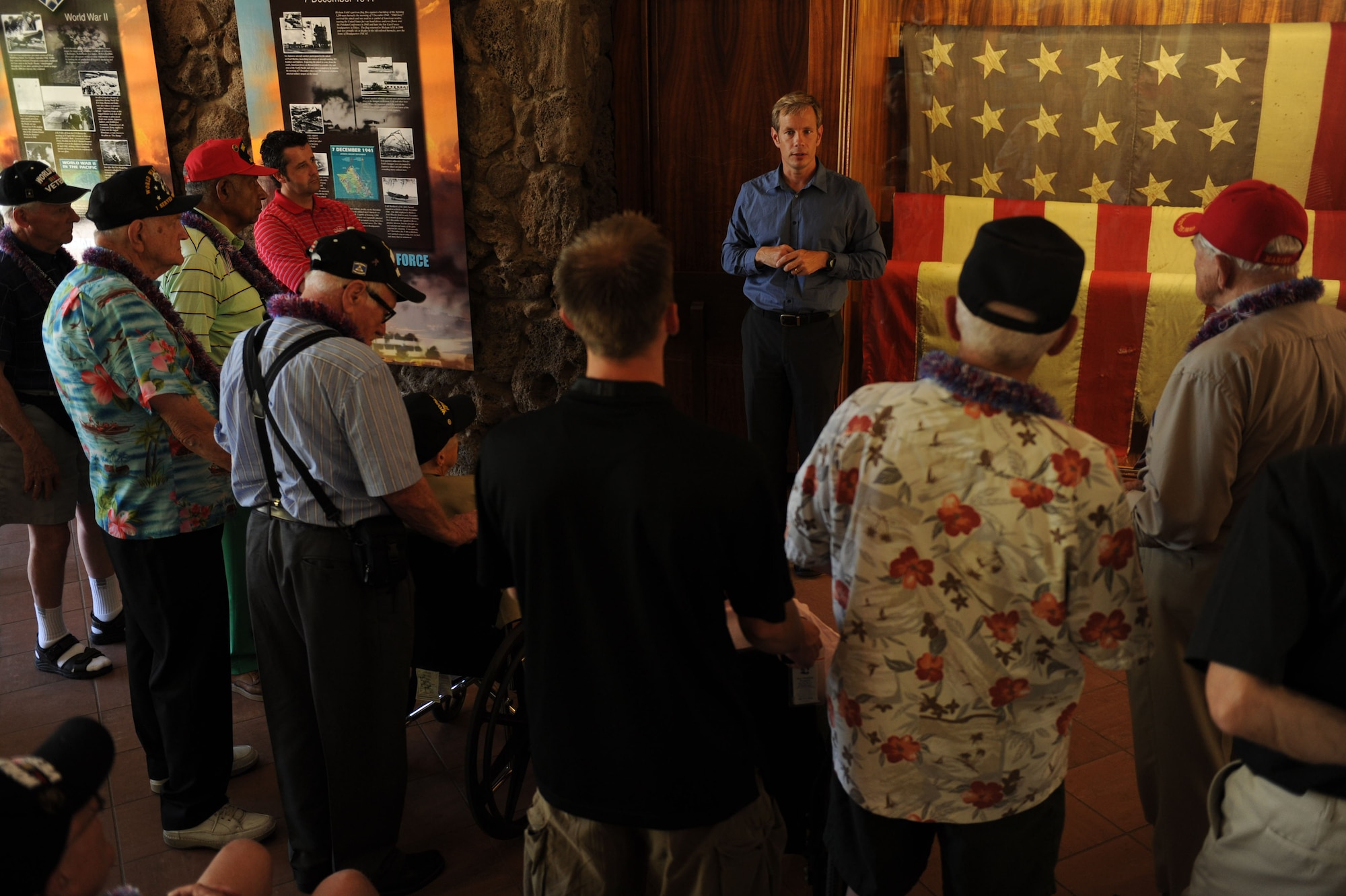 JOINT BASE PEARL HARBOR-HICKAM, Hawaii - Don Fenton, Pacific Air Forces deputy command historian, gives a tour of the Courtyard of Heros here, Aug. 30, 2011, to a group of WWII veterans. The tour was sponsored by the Greatest Generation Foundation. (U.S. Air Force photo/Staff Sgt. Gustavo Gonzalez)