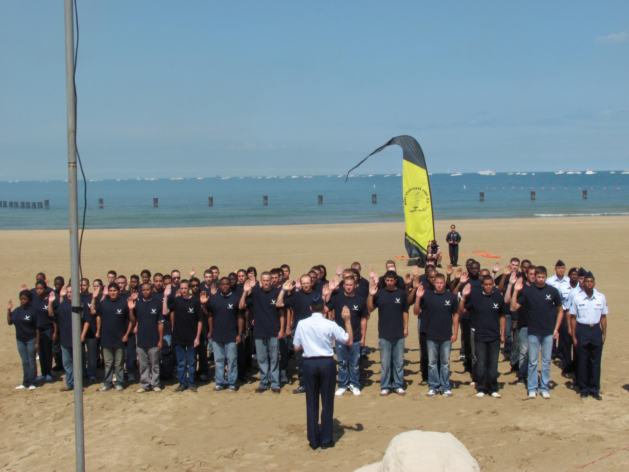 Brig. Gen. Lee K. Levy II, Air Mobility Command director of logistics, at Scott Air Force Base swore in 53 DEPpers on the 53rd anniversary of the Chicago Air and Water Show Aug. 20. Members of the 347th Recruiting Squadron also participated in a Sept. 11 memorial event honoring firemen, policemen, emergency services and military at Soldier’s Field in Chicago recently. (U.S. Air Force photo/courtesy photo)