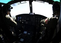 MINOT, N.D. -- 54th Helicopter Squadron UH-1N helicopter pilots, survey flood damage of Minot Aug 24. Members of the 54th HS have continually assisted in surveying local damage caused by the recent flooding situation in Minot which prompted the displacement of thousands of Minot residents, including hundreds of Air Force Global Strike Command Airmen. (U.S. Air Force Photo/Senior Airman Ashley N. Avecilla)