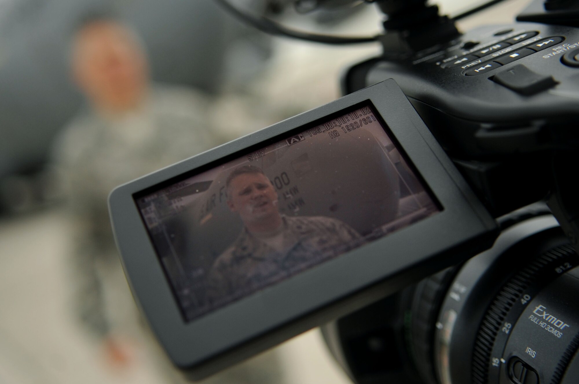 Lt. Col. Bradley Baugh, 319th Operations Support Squadron commander, is interviewed about Grand Forks Air Force Base's support in housing three C-17 Globemaster IIIs and eight KC-10 Extenders during Hurricane Irene on GFAFB Aug 27. The mission helped protect these $200 million assets by opening up the flight line to house the aircraft. (U.S. Air Force photo by Senior Airman Amanda N. Stencil)