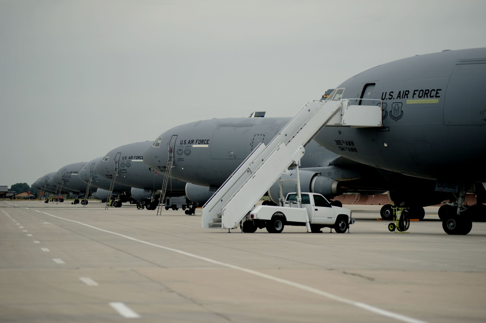 Eight KC-10 Extenders sit on the runway on Grand Forks Air Force Base Aug 27. The KC-10s are here from Joint Base McGuire-Dix-Lakehurst, N.J. in response to Hurricane Irene. The KC-10 incorporates military-specific equipment for its primary roles of the mobilization of US military assets and aerial refueling.  (U.S. Air Force photo by Senior Airman Amanda N. Stencil)