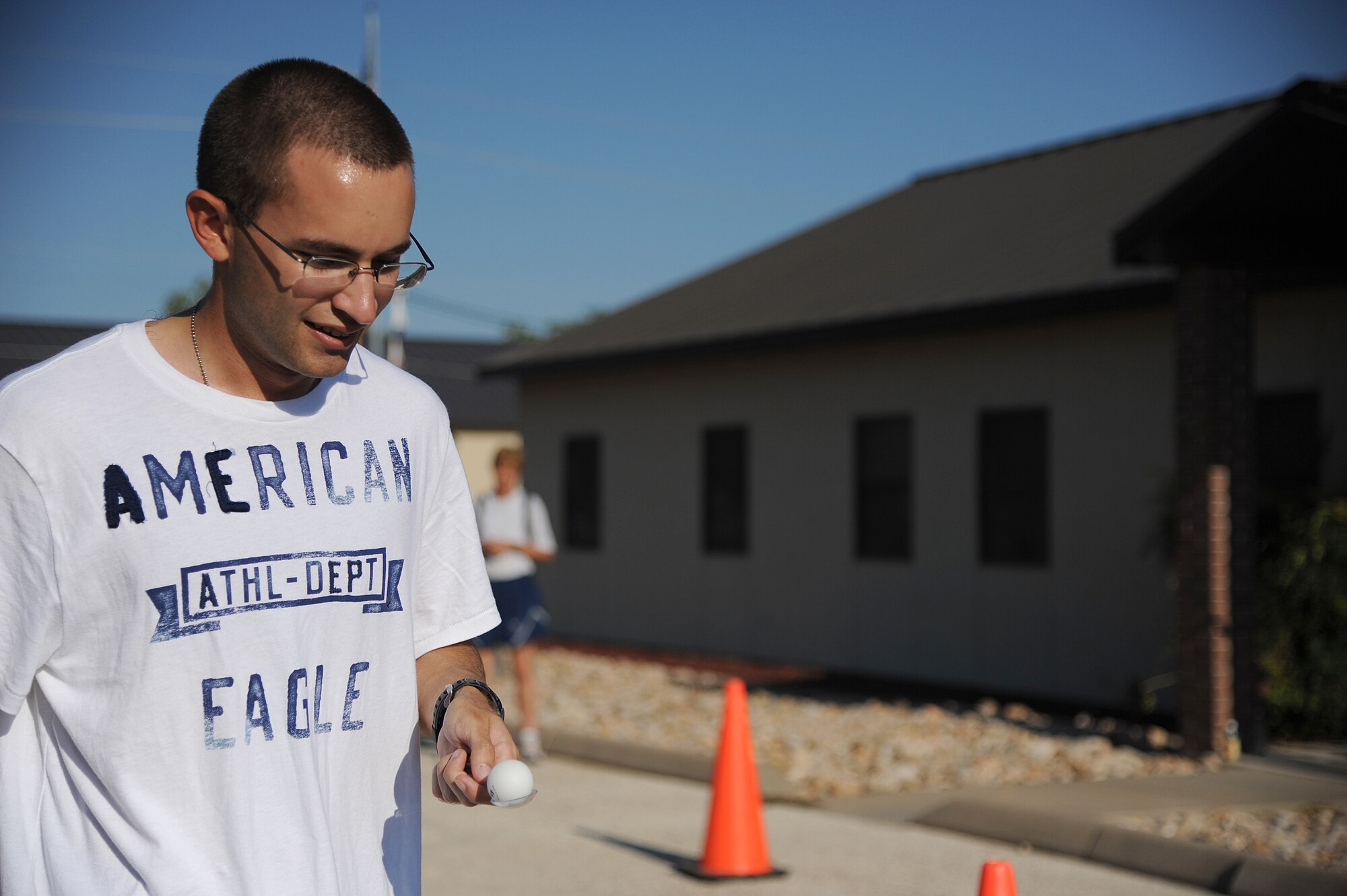 GOODFELLOW AIR FORCE BASE, Texas -- A participant of the Remarkable Race balances an egg on a spoon while walking in high heels Aug. 27. After completing each challenge a clue is revealed guiding the teams to the next challenge of the remarkable race. (U.S. Air Force photo/ Airman 1st Class Michael Smith)