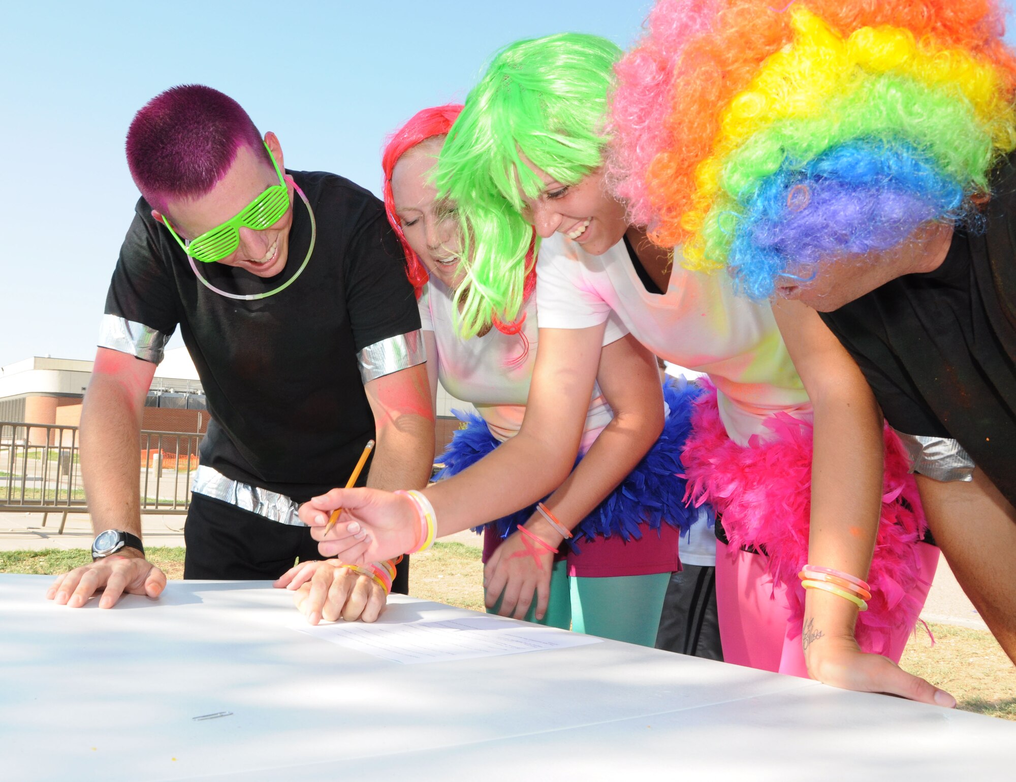 GOODFELLOW AIR FORCE BASE, Texas—Members of team Clowns undergoes the last obstacle during the Remarkable Race Aug. 27 here. To finish the race, teams have to get every question right on a quiz covering facts given at the other obstacles. (U.S. Air Force photo/Airman 1st Class Jessica Keith) 