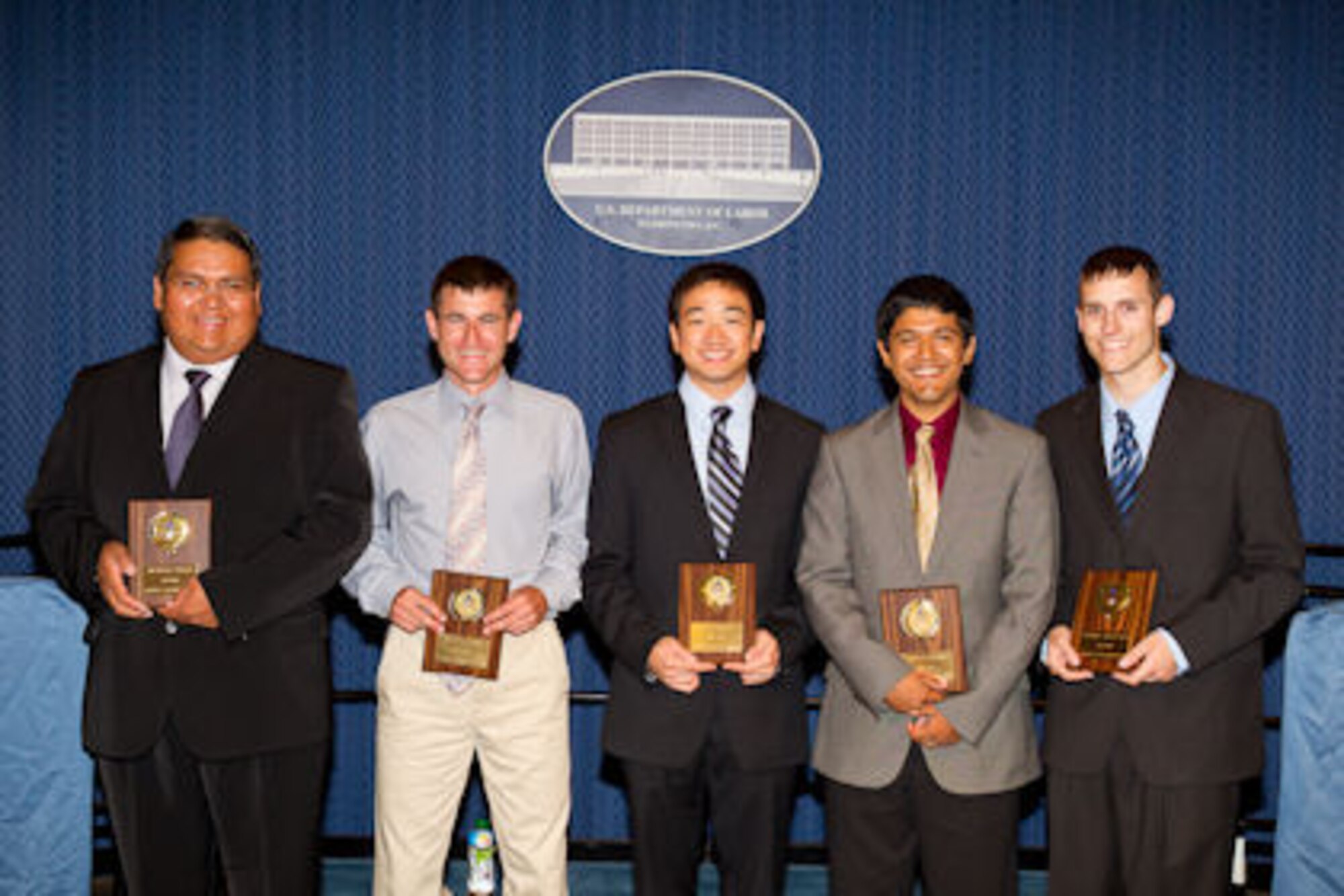 Michael Nakai, an informational technology specialist at the Air Force Safety Center, Kirtland Air Force Base, N.M., stands with Sean Jacobs, Eric Wong, Farhan Haque and Thomas Heleniak, fellow recipients of the 2011 Judith C. Gilliom Outstanding Workforce Recruitment Program for College Students with Disabilities Award during a ceremony, Aug. 5, 2011, at the U.S. Department of Labor headquarters, Washington, D.C. (U.S. Dept. of Labor photo/Shawn Moore)
