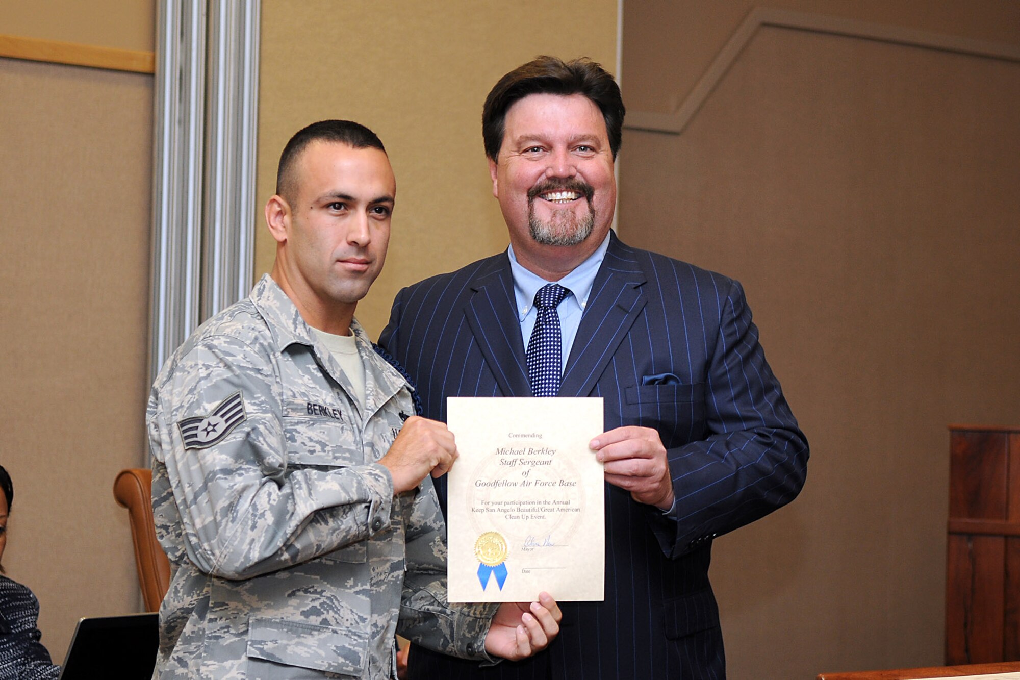 SAN ANGELO, Texas- Staff Sgt. Michael Berkley, 17th Training Support
Squadron Military Training Leader, is recognized by San Angelo Mayor Alvin
New during a City Council meeting Aug 30 for his role in the "Keep San
Angelo Beautiful" event, which was part of the "Great American Clean-up".
Berkley recruited 90 volunteers from Goodfellow to help clean the city.
(U.S. Air Force Photo /Senior Airman Heather L. Rodgers)
