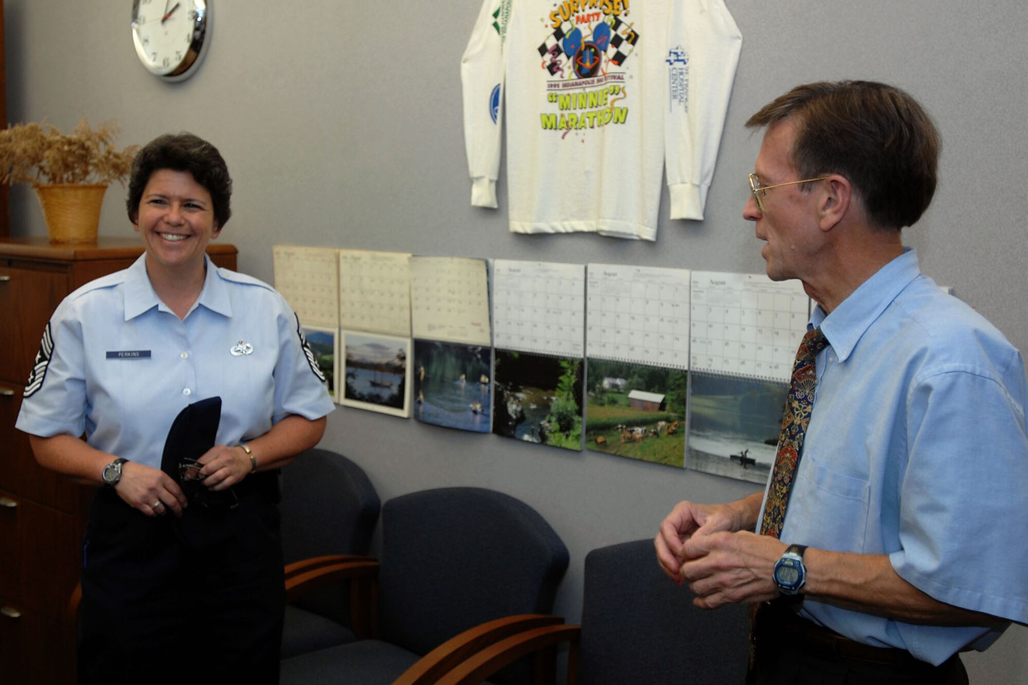 GRISSOM AIR RESERVE BASE, Ind. -- Chief Master Sgt. Karen Perkins talks with David Hughes, Grissom base civil engineer, during a recent visit to the 434th Civil Engineer Squadron complex Aug. 8. Perkins was recently named as the 434thAir Refueling Wing's command chief and visited the squadron to acquaint herself with personnel there. (U.S. Air Force photo/Senior Airman Jami K. Lancette)