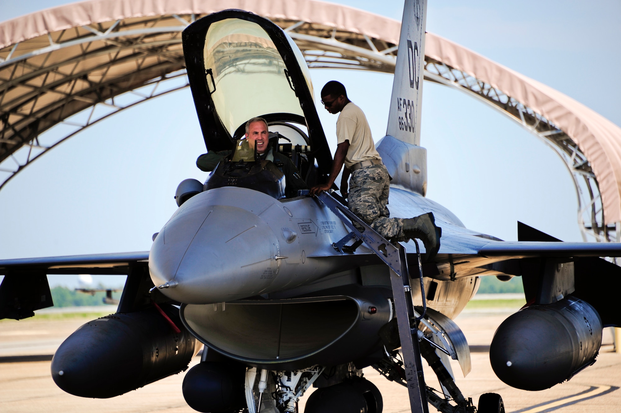 An F-16 Fighting Falcon pilot and maintainer, with the District of Columbia Air National Guard, prepare the aircraft to return home to Washington, Aug. 29 from Eglin Air Force Base, Fla.  The F-16s arrived here Aug. 26 as an evacuation measure from the impending Hurricane Irene.  (U.S. Air Force photo/Staff Sgt. Joely Santiago)