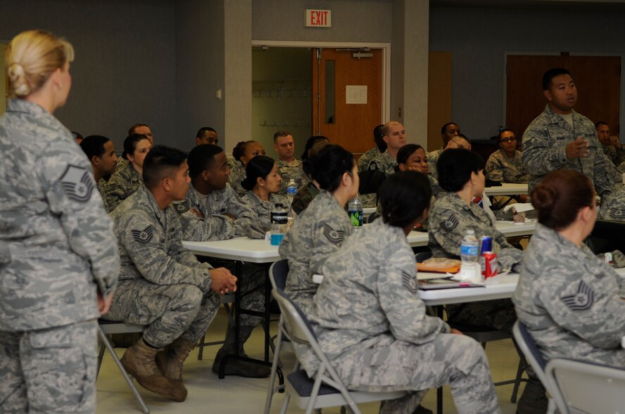 A member of Team Barksdale asks a question during the Senior NCO Professional Enhancement Course Aug. 25 at the Chapel 2 annex on Barksdale Air Force Base, La. Master Sgt. Kim Owens, 2nd Bomb Wing career assistance advisor, facilitates these and other various seminars throughout the year to prepare Airmen for career advancements.  (U.S. Air Force photo/Airman 1st Class Andrea F. Liechti) (RELEASED)