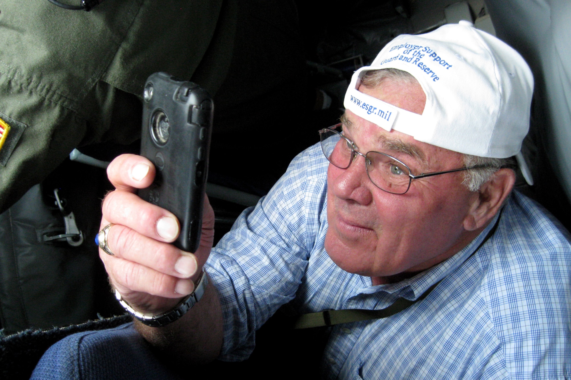 GRISSOM AIR RESERVE BASE, Ind. -- Indiana state Rep. Jim Baird takes a photo of an in-flight refueling from the boom pod of a KC-135R Stratotanker Aug. 17. Grissom hosted members of Indiana's legislature to educate them on the base and the Airmen who perform the mission here. During the mission, the group witnessed an aerial refueling between Grissom's KC-135R and an RC-135 from Offutt Air Force Base, Neb. In all, 21 people participated in the flight. (U.S. Air Force photo/Tech. Sgt. Douglas Hays)