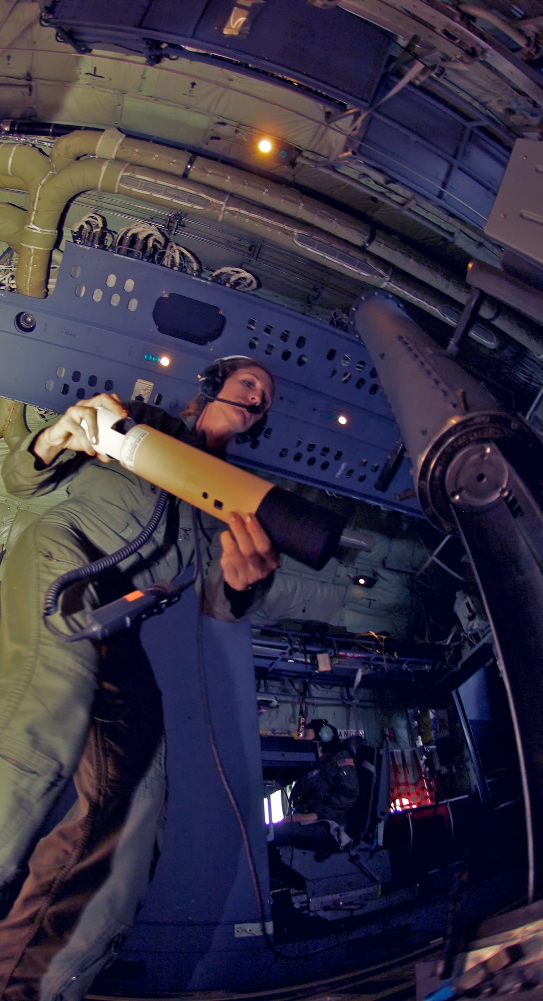 During a flight into Hurricane Irene before she made land-fall, Tech. Sgt. Amy Lee, a Dropsonde Operator with the 53rd Weather Reconnaissance Squadron's Hurricane Hunters, launches a dropsonde from the aircraft during an eye penetration. A series of dropsondes are released into the storm's eye during each pass in order to collect true wind speeds and other critical information that the National Hurricane Center uses to form more accurate predictions of the storm's path.  Any Hurricane Hunter will agree that their job entails long hours and lots of eye drops. In fact, a typical hurricane mission lasts 10-12 hours and involves four to five end-to-end trips into the eye of the storm, each time administering eye drops necessary for gathering data needed to more accuractly predict its path. 