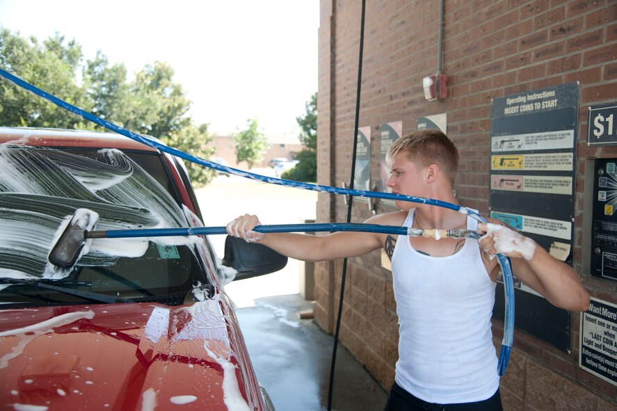 U.S. Air Force Airman Shane McCreery, active member of the Airmen Committed to Excellence committee, participates in the first sergeant’s car wash on Moody Air Force Base, Ga., Aug. 26, 2011. The car wash helped the ACE committee raise funds for future morale events. (U.S. Air Force photo by Airman 1st Class Paul Francis/Released)