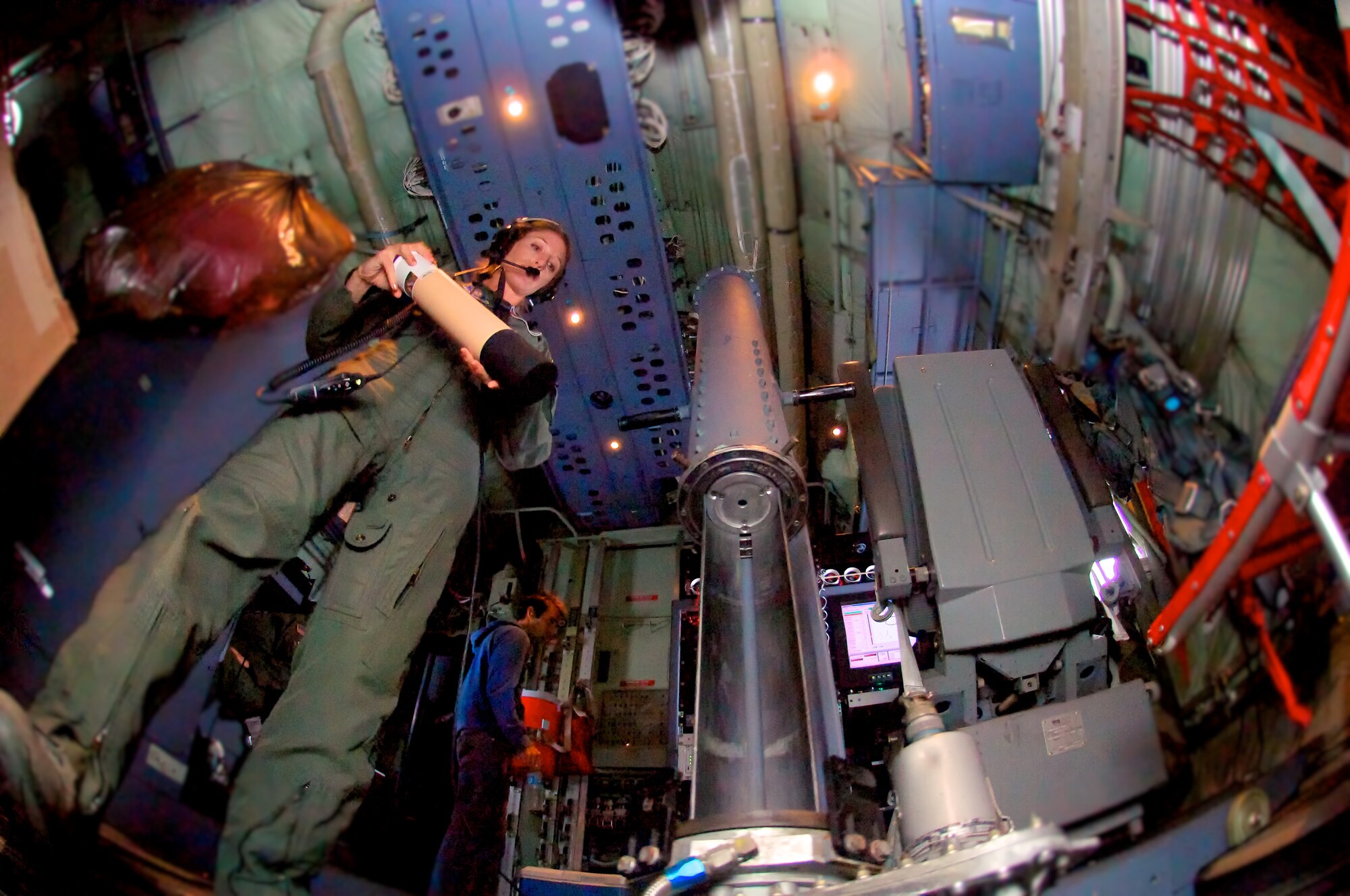 Any Hurricane Hunter will agree that their job entails long hours and lots of eye drops. In fact, a typical hurricane mission lasts 10-12 hours and involves four to five end-to-end trips into the eye of the storm, each time administering eye drops necessary for gathering data needed to more accuractly predict its path. During an afternoon-evening-night-morning visit (did I mention these flights were long) into Hurricane Irene before she made land-fall, Tech. Sgt. Amy Lee served as one of two Dropsonde Operators on board, launching a series of dropsondes out of the bottom of the aircraft via a large tube during each eye penetration.