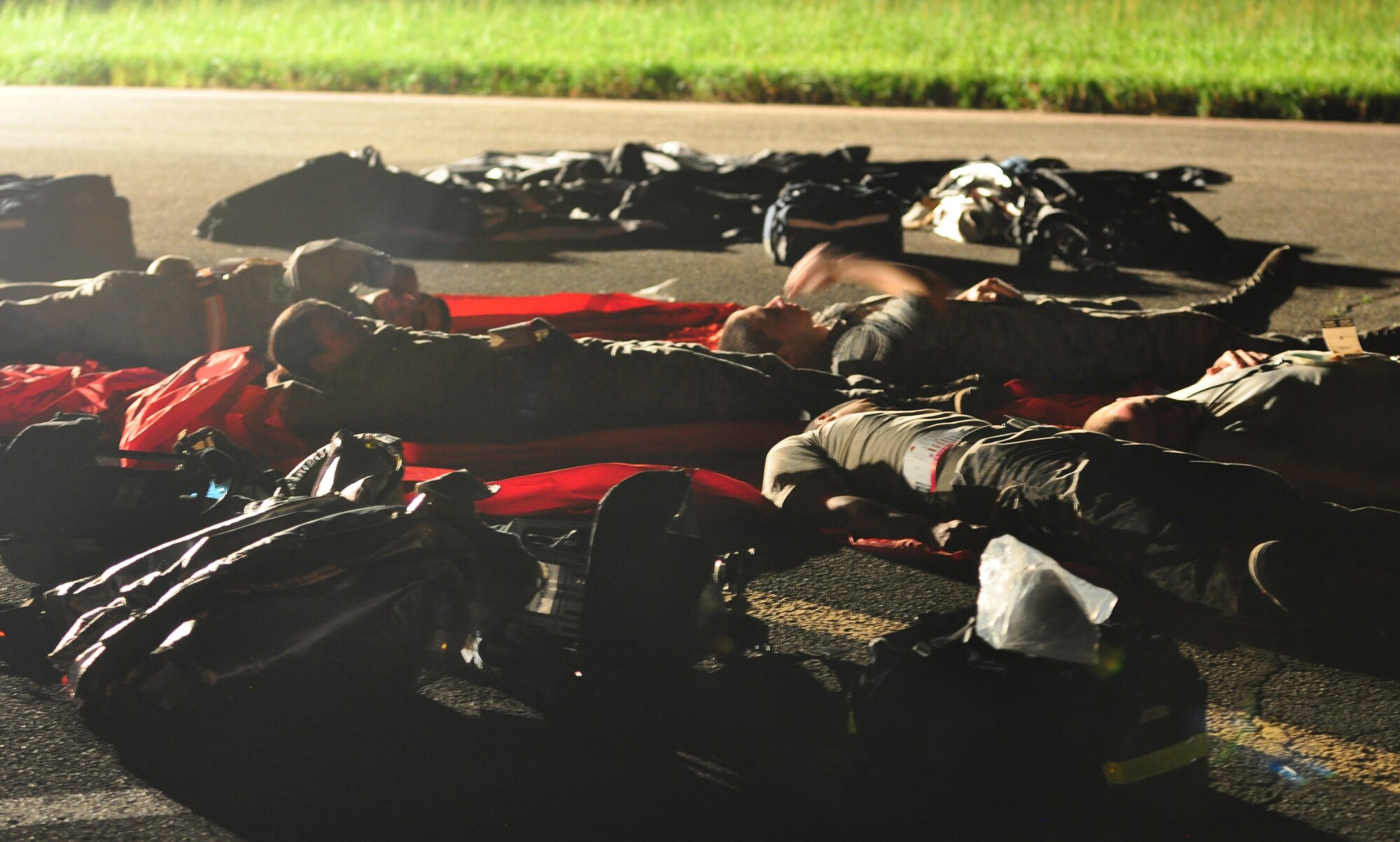 Osan’s fire department and base medics respond to a simulated C-130 Hercules aircraft crash Aug. 30, 2011, during Operational Readiness Exercise Beverley-Midnight 11-04. Exercises, such as this, test Osan’s ability to survive and operate during war-time constraints. (U.S. Air Force photos/Tech. Sgt. Chad Thompson)
