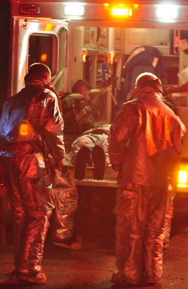 Osan’s fire department and base medics respond to a simulated C-130 Hercules aircraft crash Aug. 30, 2011, during Operational Readiness Exercise Beverley-Midnight 11-04. Exercises, such as this, test Osan’s ability to survive and operate during war-time constraints. (U.S. Air Force photos/Tech. Sgt. Chad Thompson)