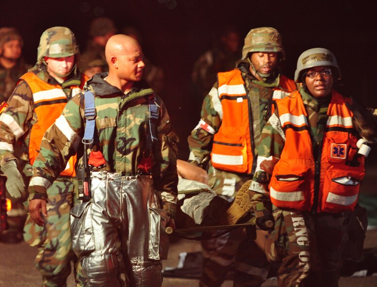 Osan’s fire department and base medics respond to a simulated C-130 Hercules aircraft crash Aug. 30, 2011, during Operational Readiness Exercise Beverley-Midnight 11-04. Exercises, such as this, test Osan’s ability to survive and operate during war-time constraints. (U.S. Air Force photos/Tech. Sgt. Chad Thompson)