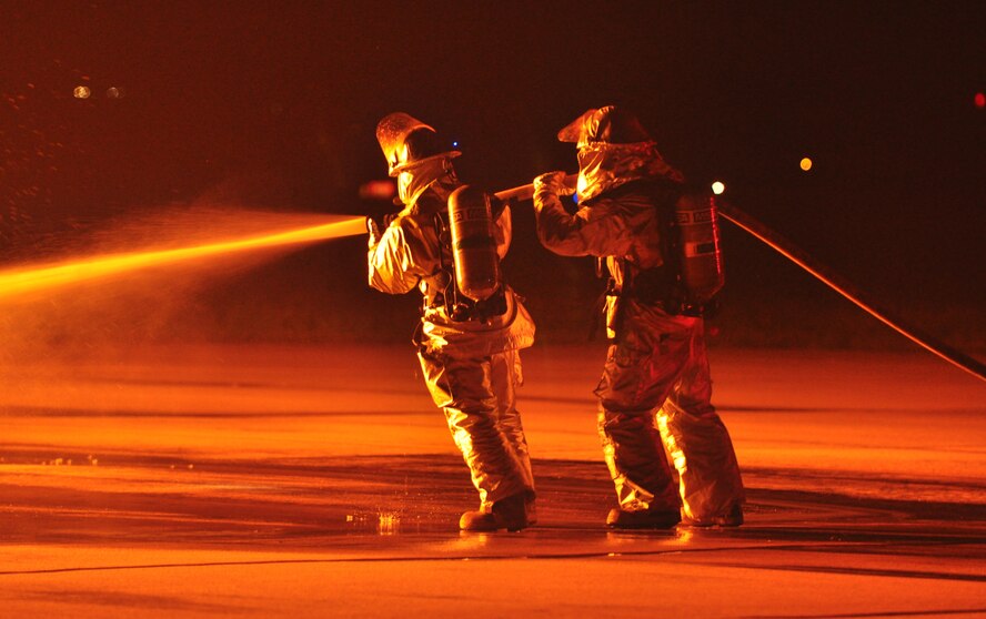 Osan’s fire department and base medics respond to a simulated C-130 Hercules aircraft crash Aug. 30, 2011, during Operational Readiness Exercise Beverley-Midnight 11-04. Exercises, such as this, test Osan’s ability to survive and operate during war-time constraints. (U.S. Air Force photos/Tech. Sgt. Chad Thompson)