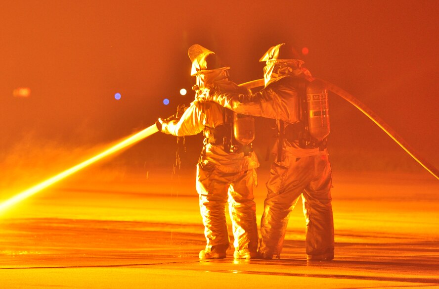 Osan’s fire department and base medics respond to a simulated C-130 Hercules aircraft crash Aug. 30, 2011, during Operational Readiness Exercise Beverley-Midnight 11-04. Exercises, such as this, test Osan’s ability to survive and operate during war-time constraints. (U.S. Air Force photos/Tech. Sgt. Chad Thompson)