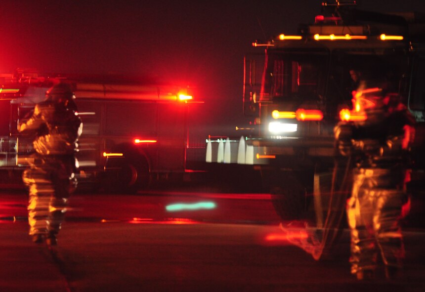 Osan’s fire department and base medics respond to a simulated C-130 Hercules aircraft crash Aug. 30, 2011, during Operational Readiness Exercise Beverley-Midnight 11-04. Exercises, such as this, test Osan’s ability to survive and operate during war-time constraints. (U.S. Air Force photos/Tech. Sgt. Chad Thompson)