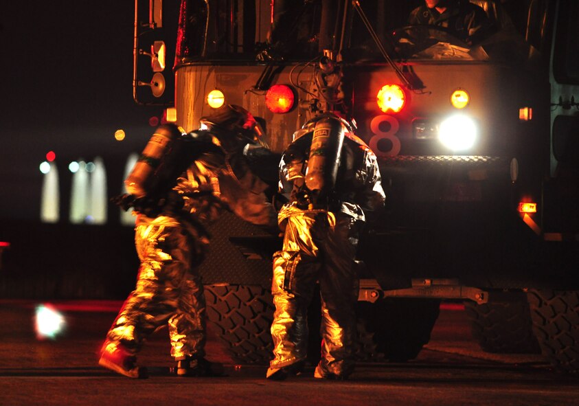 Osan’s fire department and base medics respond to a simulated C-130 Hercules aircraft crash Aug. 30, 2011, during Operational Readiness Exercise Beverley-Midnight 11-04. Exercises, such as this, test Osan’s ability to survive and operate during war-time constraints. (U.S. Air Force photos/Tech. Sgt. Chad Thompson)