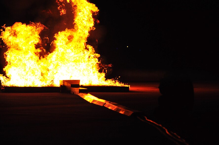 Osan’s fire department and base medics respond to a simulated C-130 Hercules aircraft crash Aug. 30, 2011, during Operational Readiness Exercise Beverley-Midnight 11-04. Exercises, such as this, test Osan’s ability to survive and operate during war-time constraints. (U.S. Air Force photos/Tech. Sgt. Chad Thompson)