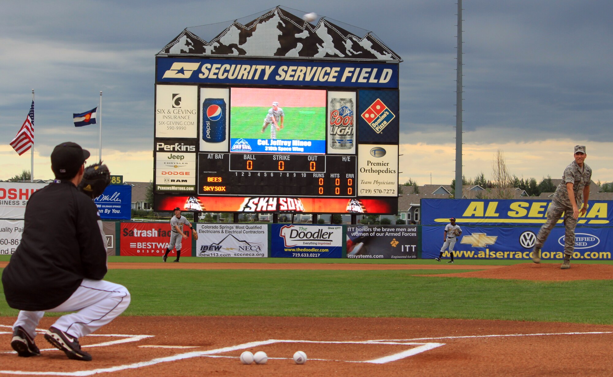 Col. Jeffrey Mineo, commander of the 310th Space Wing, throws out the first pitch at the Colorado Springs Sky Sox game on Aug. 22., at Security Service Field in Colorado Springs, Colo.
