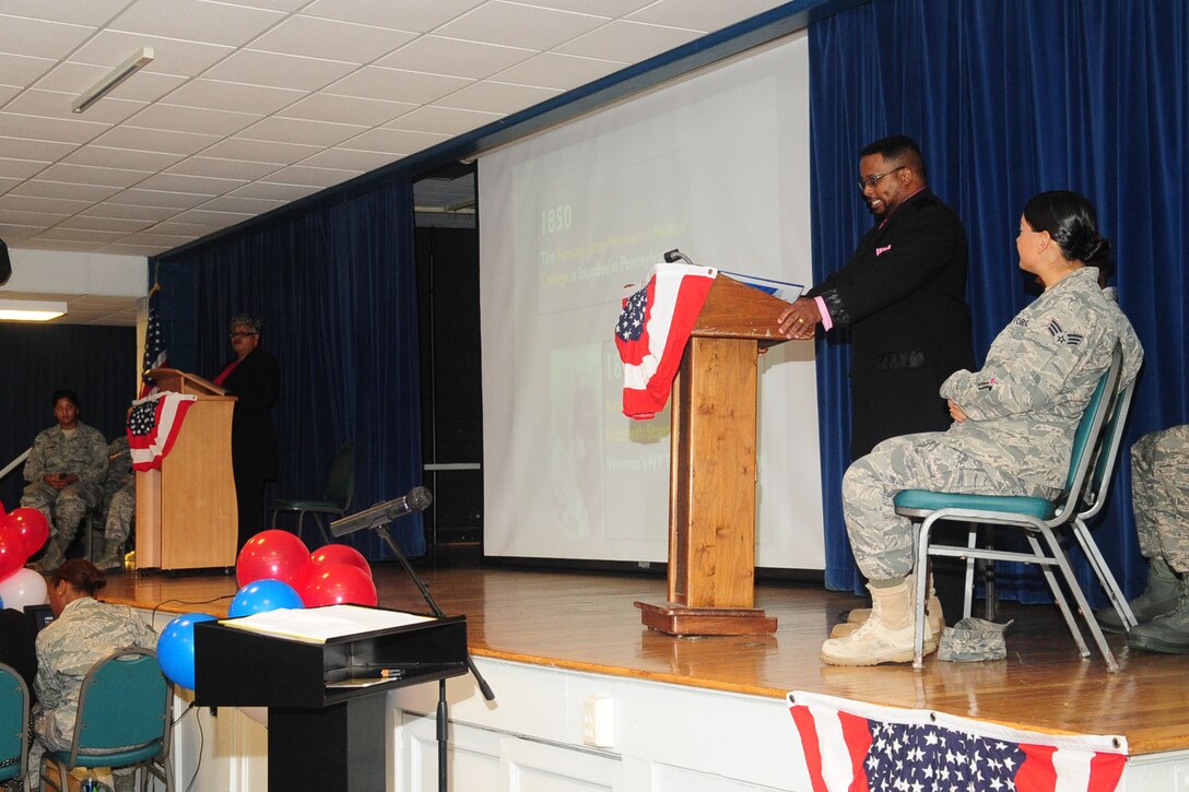 Anthony Warren, 633rd Air Base Wing Civil Engineer, debates with Deborah Rothwell, 633 ABW inspector general, on the importance of women's rights at the community center, at Langley Air Force Base, Va., August 25, 2011. The event honored national Women's Equality Day, which marks the anniversary of the passing of the 19th Amendment. (U.S. Air Force photo by Staff Sgt. Ashley Hawkins/Released)