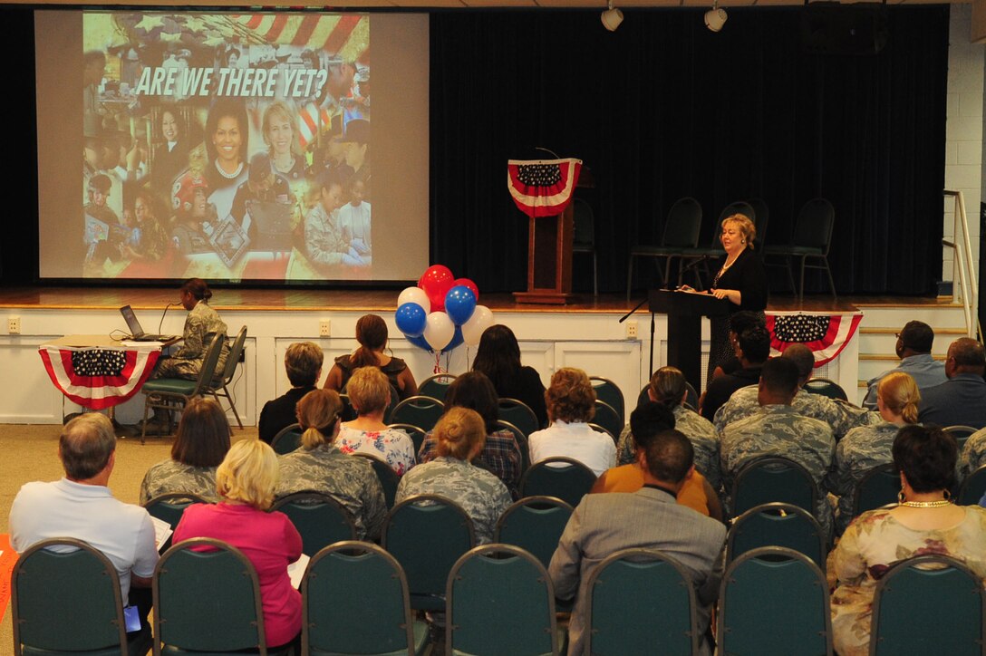 Cindy Joins, 633rd Air Base Wing Equal Opportunity director, addresses the crowd before the start of the ‘Are We There Yet?’ debate at the community center at Langley Air Force Base, Va., August 25, 2011. The event was held to celebrate national Women's Equality Day, designated by Congress August 26, 1971, which recognizes the passing of the 19th amendment to allow women the right to vote in 1970. (U.S. Air Force photo by Staff Sgt. Ashley Hawkins/Released)