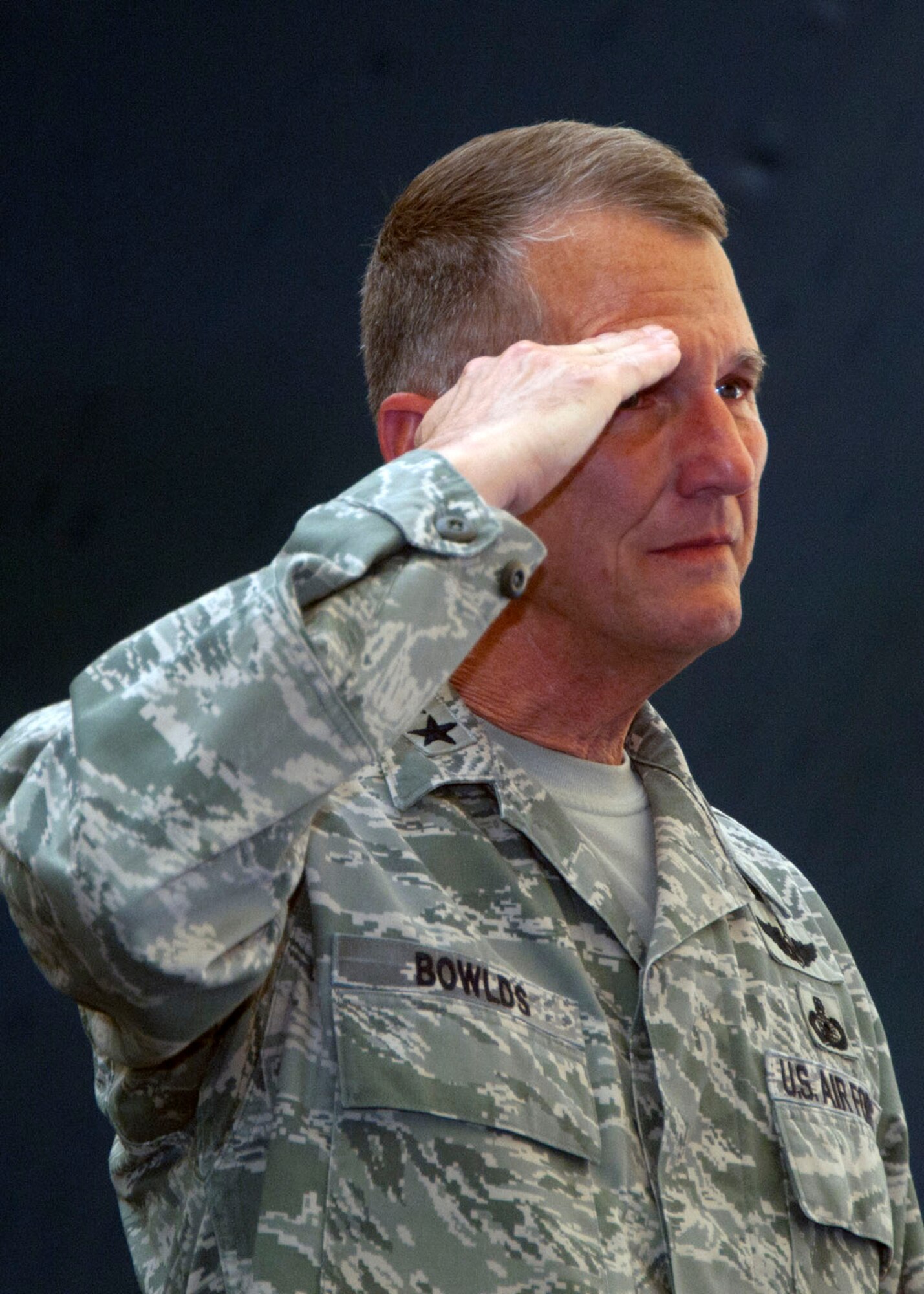 HANSCOM AIR FORCE BASE, Mass. - Lt. Gen. Ted Bowlds, Electronic Systems Center commander, salutes the attendees during a farewell event honoring him Aug. 26 in the Tennis Bubble. General Bowlds, who has been at ESC for almost four years, will be retiring from the Air Force after more than 36 years. His retirement ceremony will be Sept. 1 following the change of command. (U.S. Air Force photo)