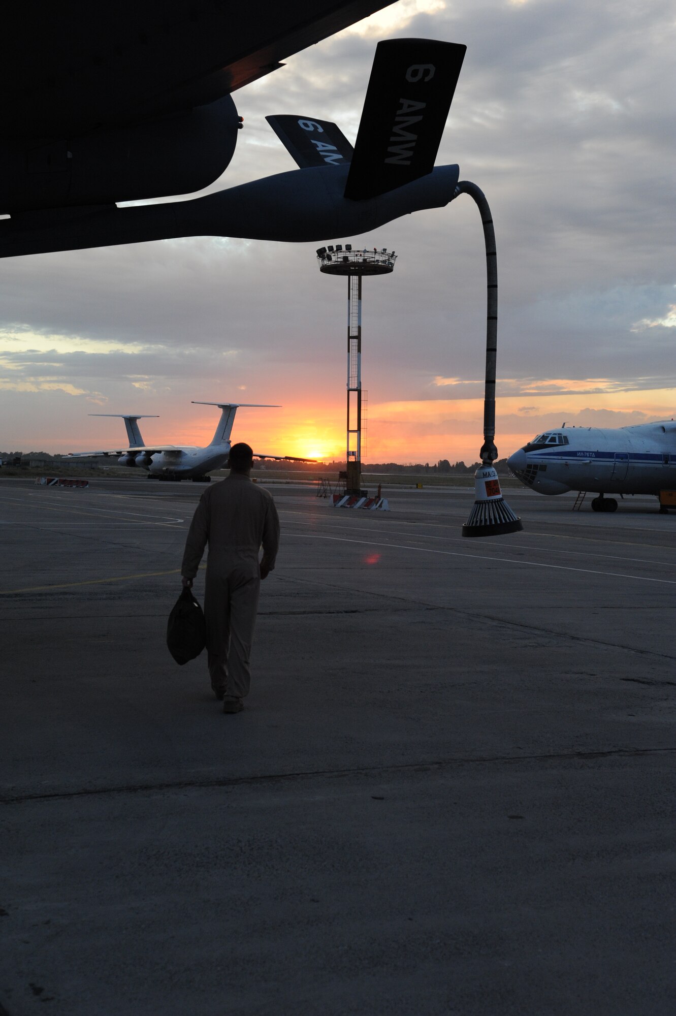 Staff Sgt. Aaron Tessmann, 22nd Expeditionary Air Refueling Squadron boom operator, walks away from a KC-135 Stratotanker after a refueling mission over Afghanistan Aug. 27. Tessman is deployed to the Transit Center at Manas, Kyrgyzstan, from the 93rd Air Refueling Squadron at Fairchild Air Force Base, Wash. (U.S. Air Force photo/Tech. Sgt. Hank Hoegen)